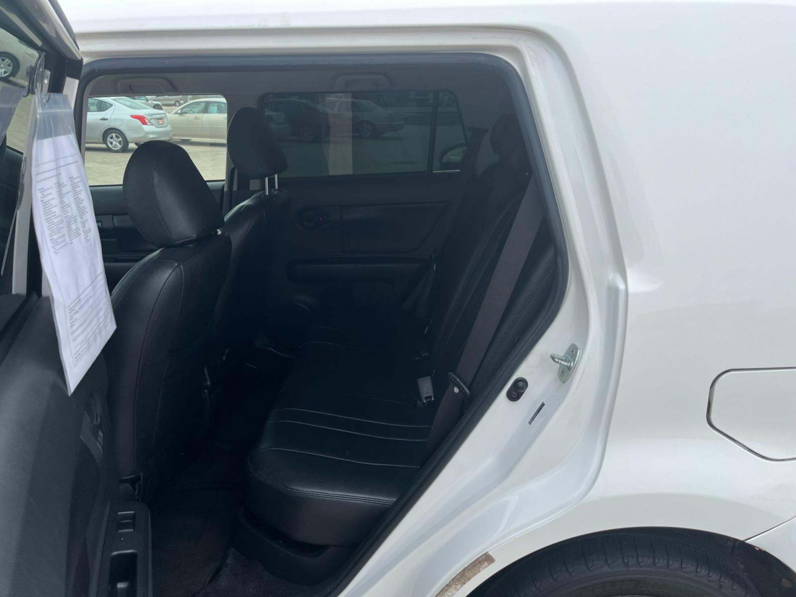 2009 white /black Scion xB Wagon (JTLKE50E591) with an 2.4L L4 DOHC 16V engine, Automatic transmission, located at 14700 Tomball Parkway 249, Houston, TX, 77086, (281) 444-2200, 29.928619, -95.504074 - Photo #9